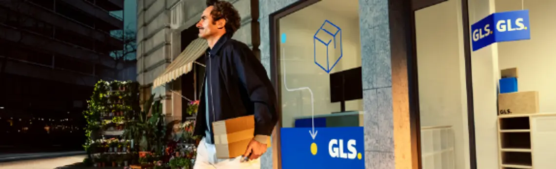 GLS delivery driver in front of ParcelShop